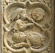 Panel 06:02 - Centaur with winged head-dress playing a pipe and tabor